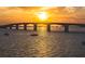 Scenic view of bridge spanning across ocean at sunset, multiple sailboats in foreground at 750 N Tamiami Trl # 604, Sarasota, FL 34236