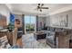 Relaxing living area with plush sofa, balcony access, and modern decor, perfect for unwinding and enjoying the views at 750 N Tamiami Trl # 604, Sarasota, FL 34236