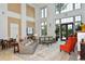 Bright lobby area featuring high ceilings, neutral colors, and lots of natural light from floor to ceiling windows at 750 N Tamiami Trl # 604, Sarasota, FL 34236