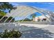 Picturesque outdoor venue featuring covered seating area surrounded by meticulously maintained landscape at 750 N Tamiami Trl # 604, Sarasota, FL 34236