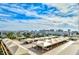 A covered parking area at a condo complex in Florida against a cloudy blue sky at 750 N Tamiami Trl # 604, Sarasota, FL 34236
