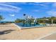 Whimsical waterfront playground with creative structures and a soft, sandy surface, perfect for families at 750 N Tamiami Trl # 604, Sarasota, FL 34236