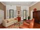 Warm and inviting sitting area with comfortable couches, lots of windows, and hardwood floors at 750 N Tamiami Trl # 604, Sarasota, FL 34236