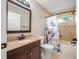 Bathroom featuring a vanity with granite top, toilet, and shower-tub combination at 7604 49Th E Ave, Bradenton, FL 34203