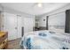 Bright bedroom with closet, a ceiling fan, and a large window allowing for lots of natural light at 7604 49Th E Ave, Bradenton, FL 34203