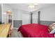 Bright bedroom with a ceiling fan, large double closet, and a neutral color scheme at 7604 49Th E Ave, Bradenton, FL 34203