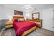 Cozy bedroom features stylish decor with a comfortable bed, a nightstand, and decorative art at 7604 49Th E Ave, Bradenton, FL 34203