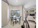 Breakfast nook with a cozy dining table, offering serene views of the pool and outdoor area at 7604 49Th E Ave, Bradenton, FL 34203