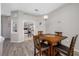 Cozy dining area with wood table adjacent to the kitchen and living spaces at 7604 49Th E Ave, Bradenton, FL 34203