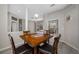 Dining room with wood table, seating for four, and a view of the outdoor patio at 7604 49Th E Ave, Bradenton, FL 34203