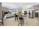 Stylish kitchen with white cabinets, stainless steel appliances, and a functional breakfast bar at 7604 49Th E Ave, Bradenton, FL 34203
