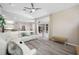 Spacious living room with a sliding glass door, plush sofa, and modern decor at 7604 49Th E Ave, Bradenton, FL 34203