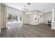 Open-concept living room with sliding glass doors and views of the inviting pool and patio area at 7604 49Th E Ave, Bradenton, FL 34203