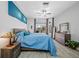 Relaxing main bedroom with view, fan, lots of natural light, and hardwood floors at 7604 49Th E Ave, Bradenton, FL 34203