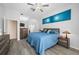 Main bedroom featuring ceiling fan, lots of light, and hardwood floors at 7604 49Th E Ave, Bradenton, FL 34203