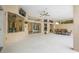 Covered patio with ceiling fan and tiled floors, perfect for entertaining and relaxing with outdoor dining area at 7604 49Th E Ave, Bradenton, FL 34203
