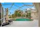Private enclosed pool and spa area, including a sun umbrella with plenty of space for outdoor furniture at 7604 49Th E Ave, Bradenton, FL 34203