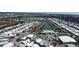 Aerial view of community featuring a marina, clubhouse, pool, and well-maintained landscaping at 789 N Green Cir, Venice, FL 34285