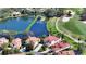 Beautiful aerial view of golf course and lakefront homes with lush landscaping and manicured lawns at 8025 Via Fiore, Sarasota, FL 34238
