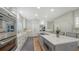Bright kitchen features stainless appliances, spacious counters, and a large center island with seating at 8025 Via Fiore, Sarasota, FL 34238
