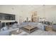 Open-concept living and dining area with a large sectional sofa, hardwood floors, and high ceilings at 8025 Via Fiore, Sarasota, FL 34238