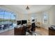 Bright office space with natural light, overlooking the pool and lush landscaping at 8025 Via Fiore, Sarasota, FL 34238