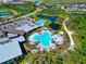 Aerial view of community amenities including a large pool, a lap pool, and a hot tub at 8262 Velda Trl, Sarasota, FL 34241