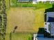 Aerial view of the home's fenced backyard, offering privacy and ample green space at 8262 Velda Trl, Sarasota, FL 34241