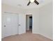 Bedroom with carpet flooring, ceiling fan and a closet at 8262 Velda Trl, Sarasota, FL 34241