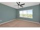 Bedroom with neutral carpet, ceiling fan and a window with a view at 8262 Velda Trl, Sarasota, FL 34241