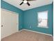 Bedroom with neutral carpet, closet and window for natural light at 8262 Velda Trl, Sarasota, FL 34241