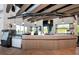 Cafe area with a modern counter, display cases, and pendant lighting at 8262 Velda Trl, Sarasota, FL 34241