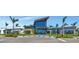 Modern community center with glass facade, palm trees and well-maintained landscaping at 8262 Velda Trl, Sarasota, FL 34241