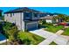 Charming two-story home with a well-manicured lawn and attached two-car garage at 8262 Velda Trl, Sarasota, FL 34241