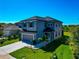 Two-story home featuring a well-manicured lawn and modern exterior at 8262 Velda Trl, Sarasota, FL 34241