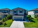 Two-story home featuring a well-manicured lawn and modern exterior at 8262 Velda Trl, Sarasota, FL 34241