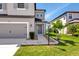Charming two-story home features a spacious driveway and a beautifully landscaped front yard at 8262 Velda Trl, Sarasota, FL 34241