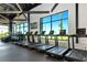 State-of-the-art fitness center equipped with modern treadmills and large windows at 8262 Velda Trl, Sarasota, FL 34241