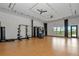 Functional fitness area featuring weights, a power rack, and space for bodyweight exercises at 8262 Velda Trl, Sarasota, FL 34241