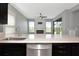Kitchen featuring stainless steel appliances and a view into the living room at 8262 Velda Trl, Sarasota, FL 34241