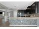 Kitchen view featuring stainless steel appliances, stone island, and open layout at 8262 Velda Trl, Sarasota, FL 34241