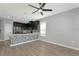Kitchen featuring stainless steel appliances, stone island, and a ceiling fan at 8262 Velda Trl, Sarasota, FL 34241