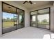 View of the lanai with sliding glass doors leading to both interior and exterior living areas at 8262 Velda Trl, Sarasota, FL 34241
