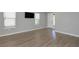 Living area with gray walls, modern flooring, and views to the outside at 8262 Velda Trl, Sarasota, FL 34241
