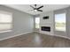 Bright living room featuring a fireplace and large windows offering ample natural light at 8262 Velda Trl, Sarasota, FL 34241