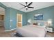 Beautiful main bedroom with ceiling fan, and ensuite bathroom featuring a soaking tub at 8262 Velda Trl, Sarasota, FL 34241
