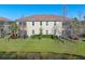 A backyard overlooking a pond creating a serene and private atmosphere at 8323 Enclave Way # 104, Sarasota, FL 34243