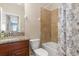 Bathroom with granite vanity, tub shower combo with decorative tile at 8323 Enclave Way # 104, Sarasota, FL 34243