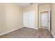 Bedroom with new laminate flooring and double closet at 8323 Enclave Way # 104, Sarasota, FL 34243