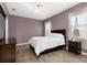 Bedroom with wood-look flooring, a large window, and a double bed at 8323 Enclave Way # 104, Sarasota, FL 34243